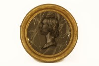 Lot 517 - A circular relief decorated plaque of a gentleman in a gilt frame