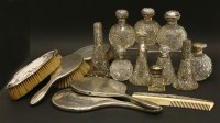 Lot 146 - A quantity of silver topped dressing table bottles and jars