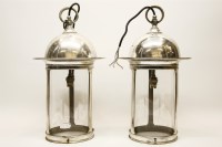 Lot 555A - A pair of chrome and glass pendant ceiling lights