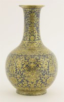 Lot 54 - A gilt-decorated powder blue bottle vase