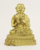 Lot 454 - A gilt bronze lama