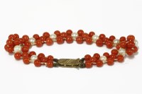 Lot 39 - A three row coral bead and cultured pearl bracelet