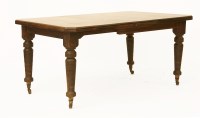 Lot 559 - A late 19th century mahogany extending dining table on turned legs