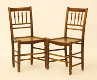 Lot 561 - A pair of 19th century elm and ash country chairs with spindle backs and solid seats.