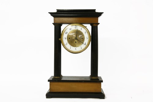 Lot 345 - A 19th century French ebonised portico clock
