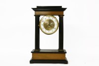 Lot 345 - A 19th century French ebonised portico clock