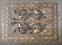 Lot 707 - An antique Persian rug decorated with tree of life design