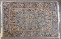 Lot 575 - An antique Persian blue ground rug