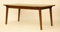 Lot 549 - An Ercol extending oak dining table