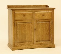 Lot 706 - An Ercol oak dresser base/cupboard