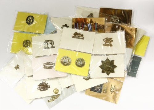 Lot 135 - A large collection of military cap and other badges