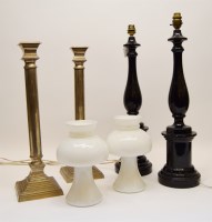 Lot 352 - A pair of ebonised table lamps