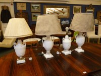 Lot 390 - A pair of blanc de chine porcelain table lamps