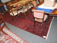 Lot 635 - A Turkoman style red ground carpet