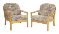 Lot 703 - A pair of teak armchairs