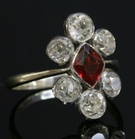 Lot 155 - A red paste and diamond fingerline cluster ring