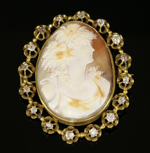Lot 54 - A late Victorian diamond set shell cameo brooch