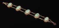 Lot 123 - An American jade and seed pearl bracelet