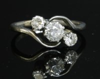 Lot 161 - A three stone graduated diamond crossover ring