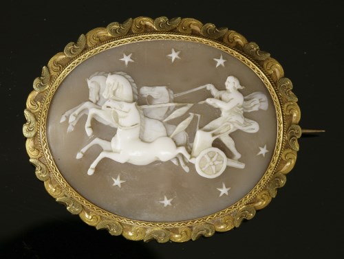 Lot 62 - A Victorian gold-mounted shell cameo brooch depicting Aurora in a chariot riding across the night sky