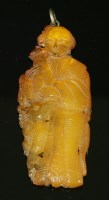 Lot 126 - A Chinese carved amber pendant