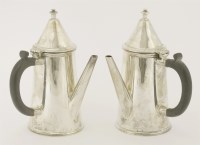 Lot 536 - A pair of George V silver coffee pots