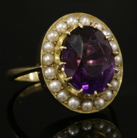 Lot 29 - A gold amethyst and split pearl cluster ring