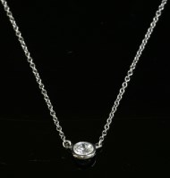 Lot 351 - A platinum single stone diamond pendant
