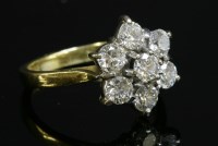 Lot 288 - An 18ct gold seven stone diamond cluster ring
