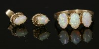Lot 226 - A gold three stone opal ring