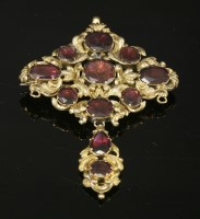 Lot 4 - A gold flat cut garnet set lozenge brooch/pendant