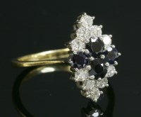 Lot 342 - An 18ct gold sapphire and diamond lozenge shape cluster ring