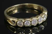 Lot 316 - An 18ct gold diamond set half eternity ring