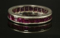 Lot 156 - An Art Deco white gold ruby eternity ring