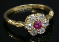 Lot 105 - An 18ct gold Edwardian ruby and diamond daisy cluster ring