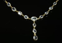 Lot 332 - A gold aquamarine and sapphire 'Y' necklace