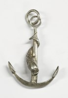Lot 54 - An anchor and dolphin pendant