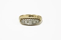 Lot 29 - An Edwardian gold five stone graduated diamond boat shaped ring