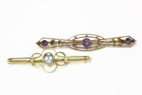 Lot 13 - A gold oval cut blue paste and seed pearl bar brooch