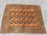 Lot 574A - An Afghan rust ground rug