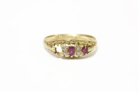 Lot 18 - An 18ct gold three stone ruby ring