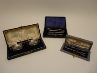 Lot 149 - A pair of silver boat shaped salts with spoons