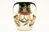Lot 236 - A large modern Moorcroft 'Anna Lily' pattern twin handled vase