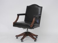 Lot 458 - A modern green leather desk chair