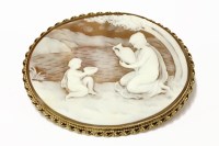 Lot 41 - A 9ct gold mounted shell cameo brooch of a young maiden in a landscape setting