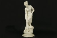 Lot 308 - An early 20th century carved figure of a female on a stand