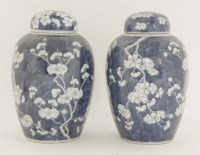 Lot 42 - A pair of Chinese blue and white ginger jars and covers