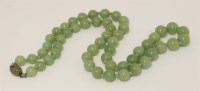 Lot 505 - A jade bead necklace