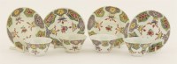 Lot 91 - A set of four semi-eggshell famille rose tea bowls and saucers