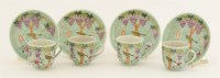 Lot 126 - A set of four Chinese famille rose coffee cups and saucers